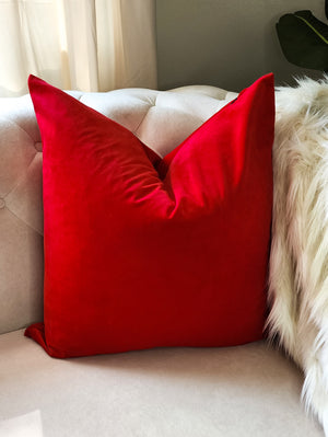 Red decorative velvet pillow