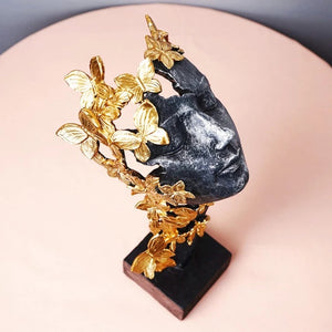 Butterfly Lady Gold and Black Face Statue shown from front with a stand