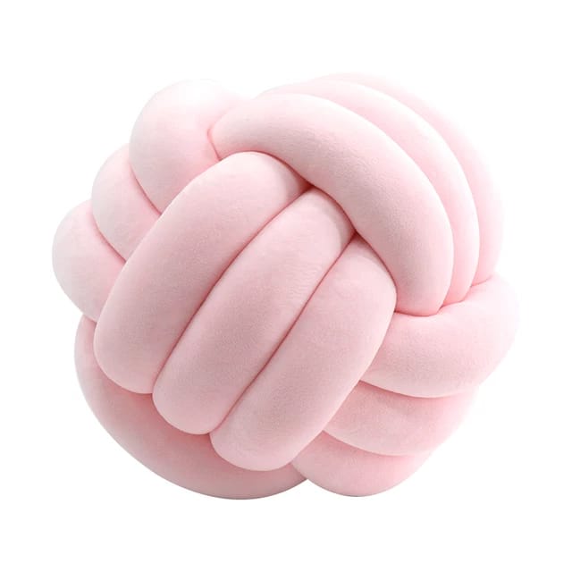 Decorative velvet knot pillow with a knot detail that adds dimension and interest