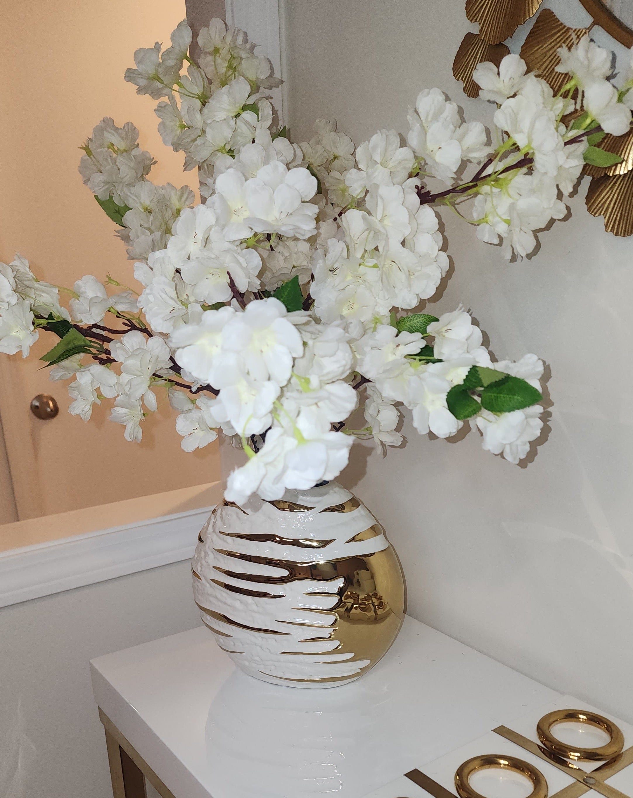 White ceramic vase with gold texture