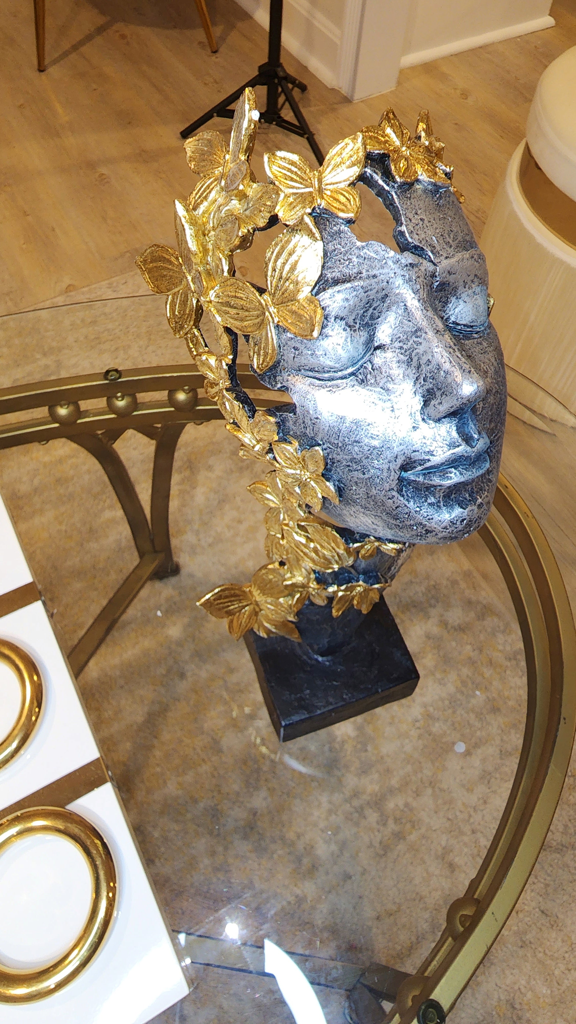 Butterfly with golden color on face of a Lady Gold and Black Face Statue