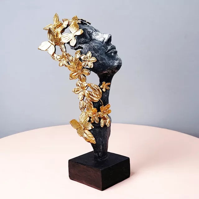 butterfly lady gold and black face statue 