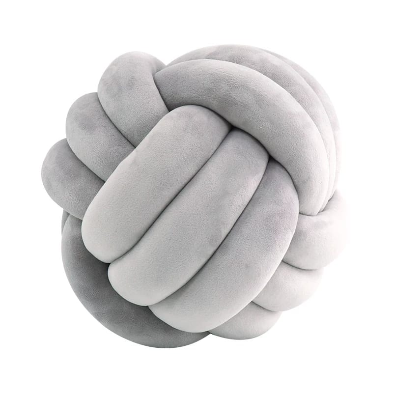 Vibrant velvet knot pillow with a pop of color for a modern touch